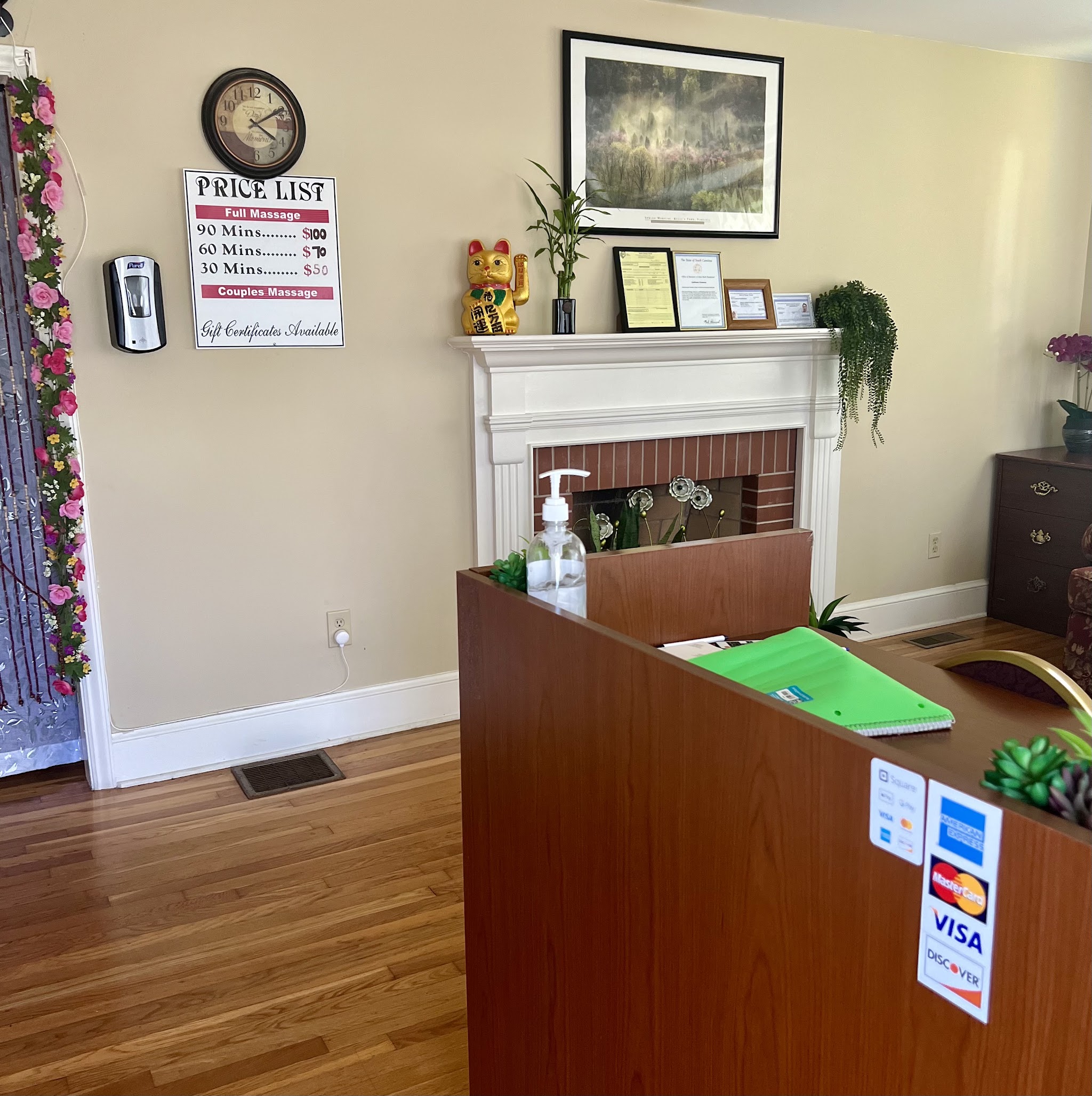 Our front room with the price list on the wall, a fireplace mantel and the front desk